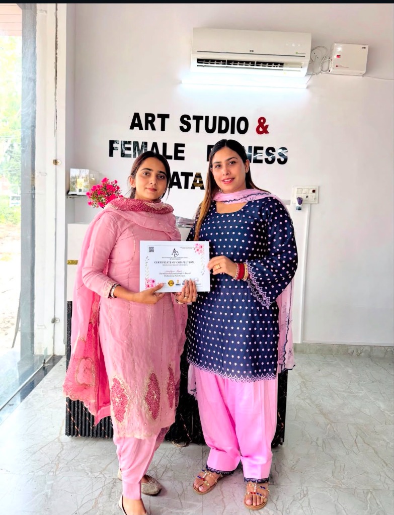 Student receiving certificate recognition at Art Studio Batala