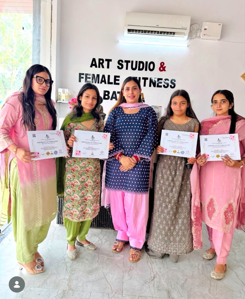 Multiple students with certificates together with academy representative